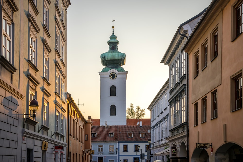 a tall clock tower towering over a city street