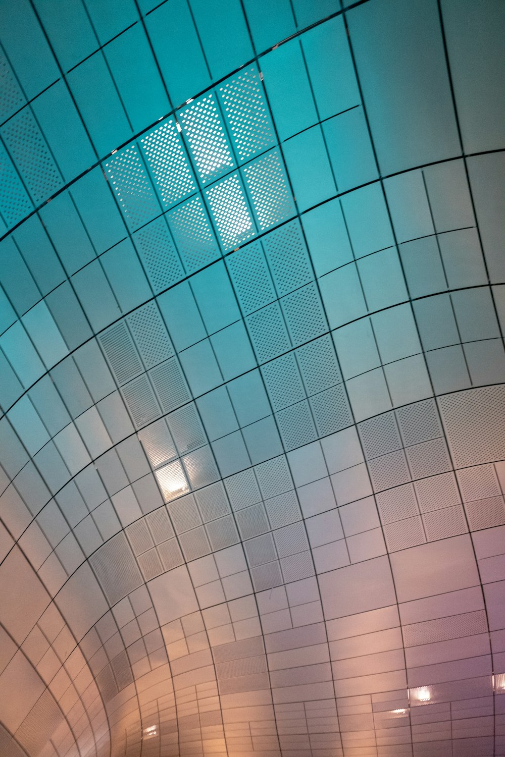 a bathroom with a tiled ceiling and tiled walls