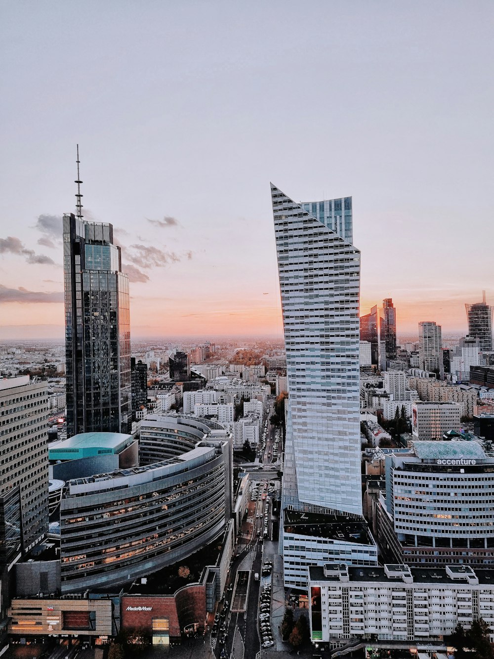 an aerial view of a city with tall buildings