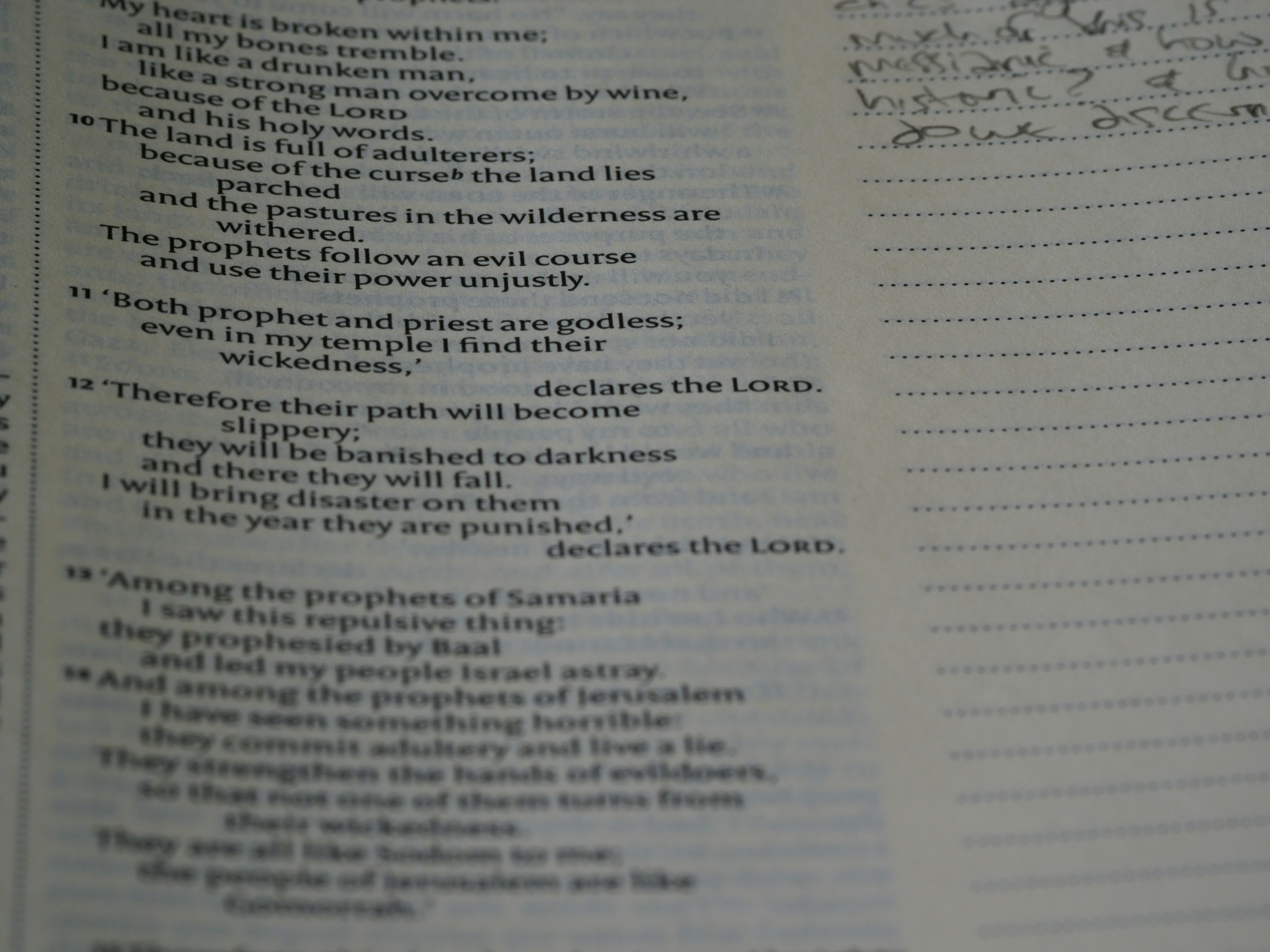 Parenting prayer guide open to a page with handwritten notes and a child's drawing.