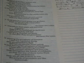 A notebook open with handwritten prophetic words and reflections.