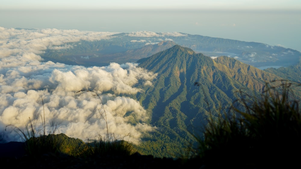 a view of a mountain covered in clouds