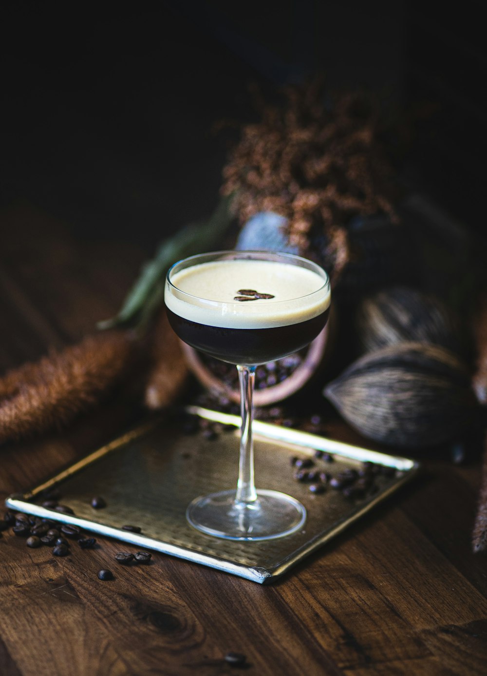 a drink sitting on top of a metal tray