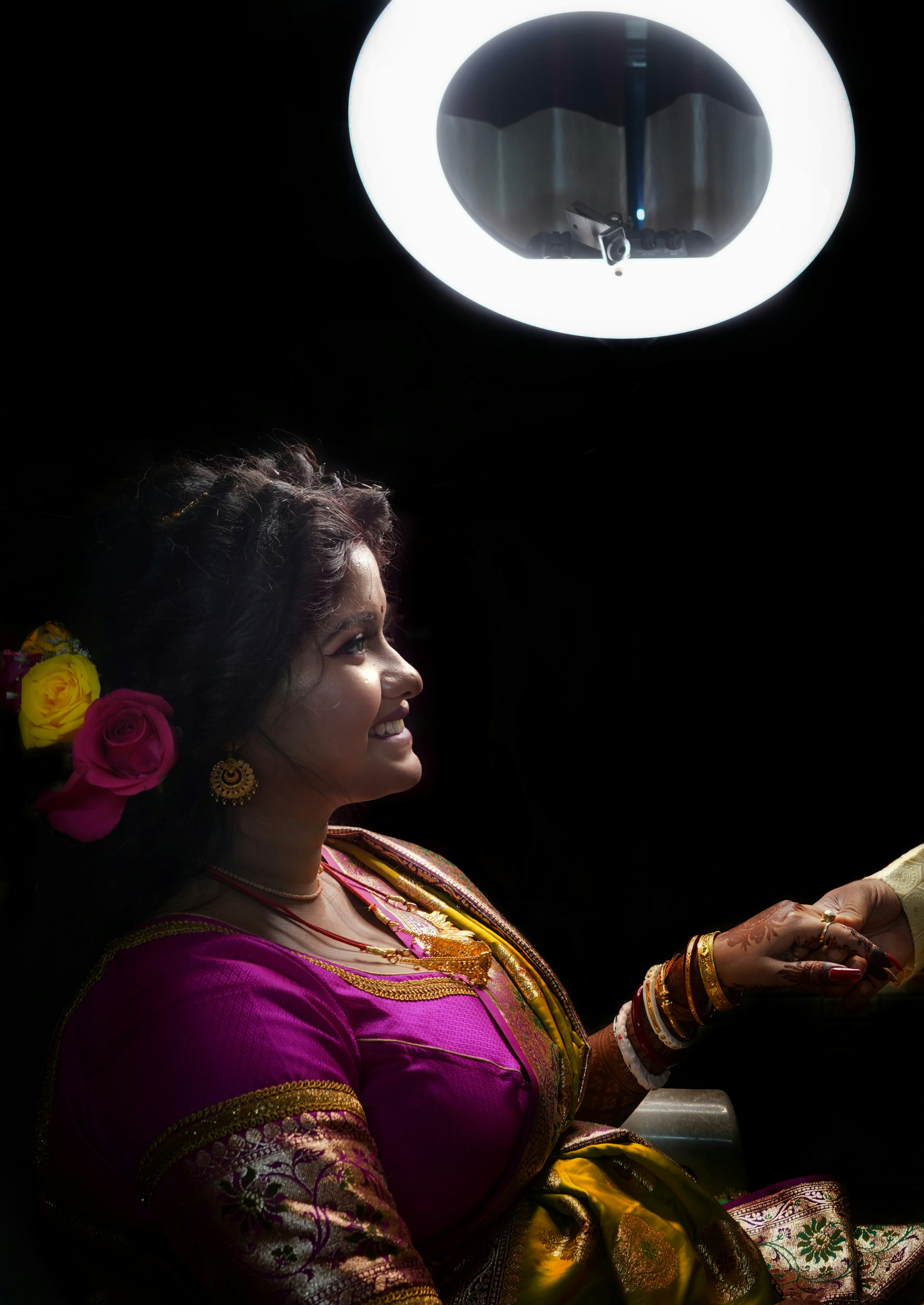 a woman sitting in a chair in front of a mirror
