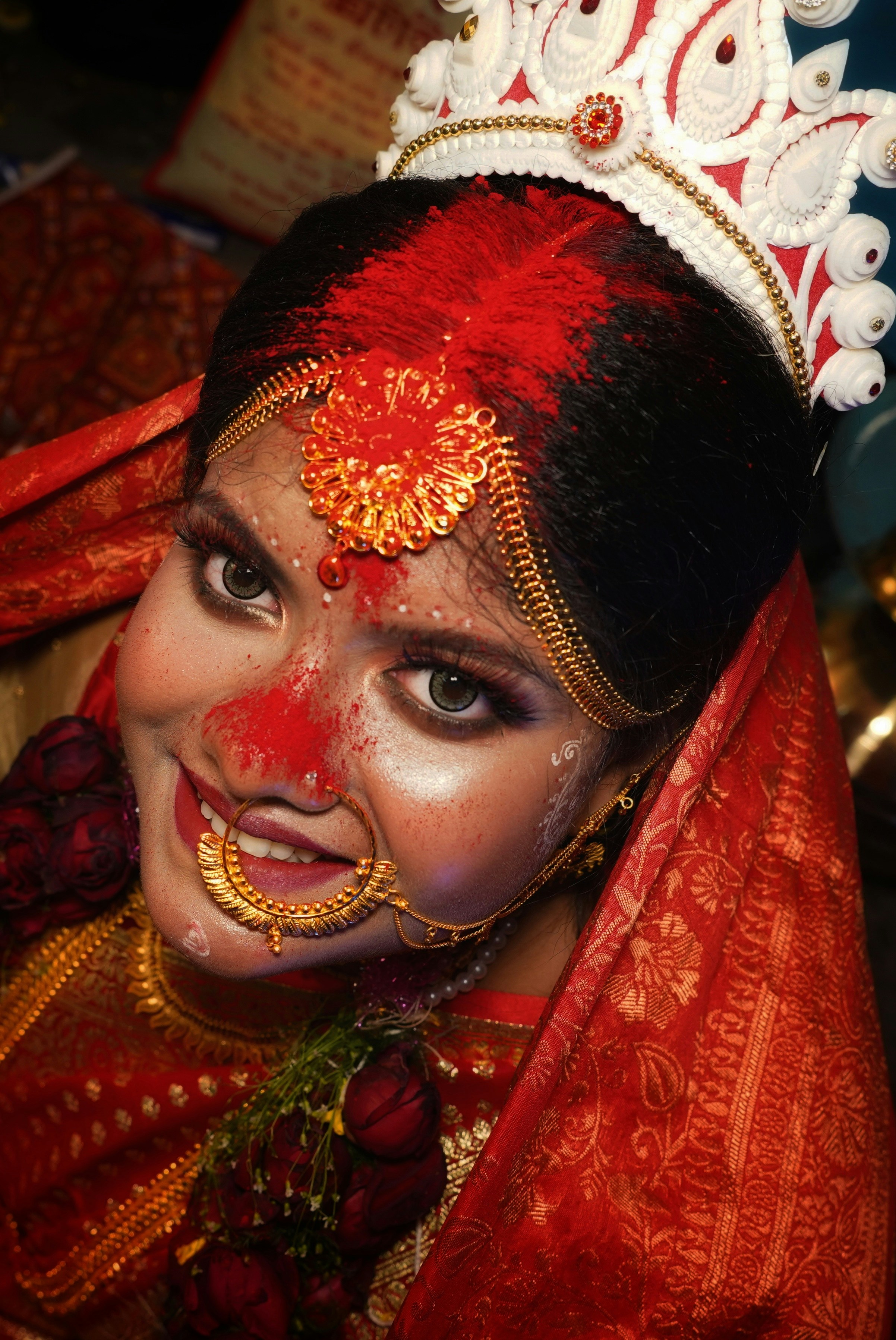 a woman wearing a red and gold costume