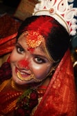 a woman wearing a red and gold costume