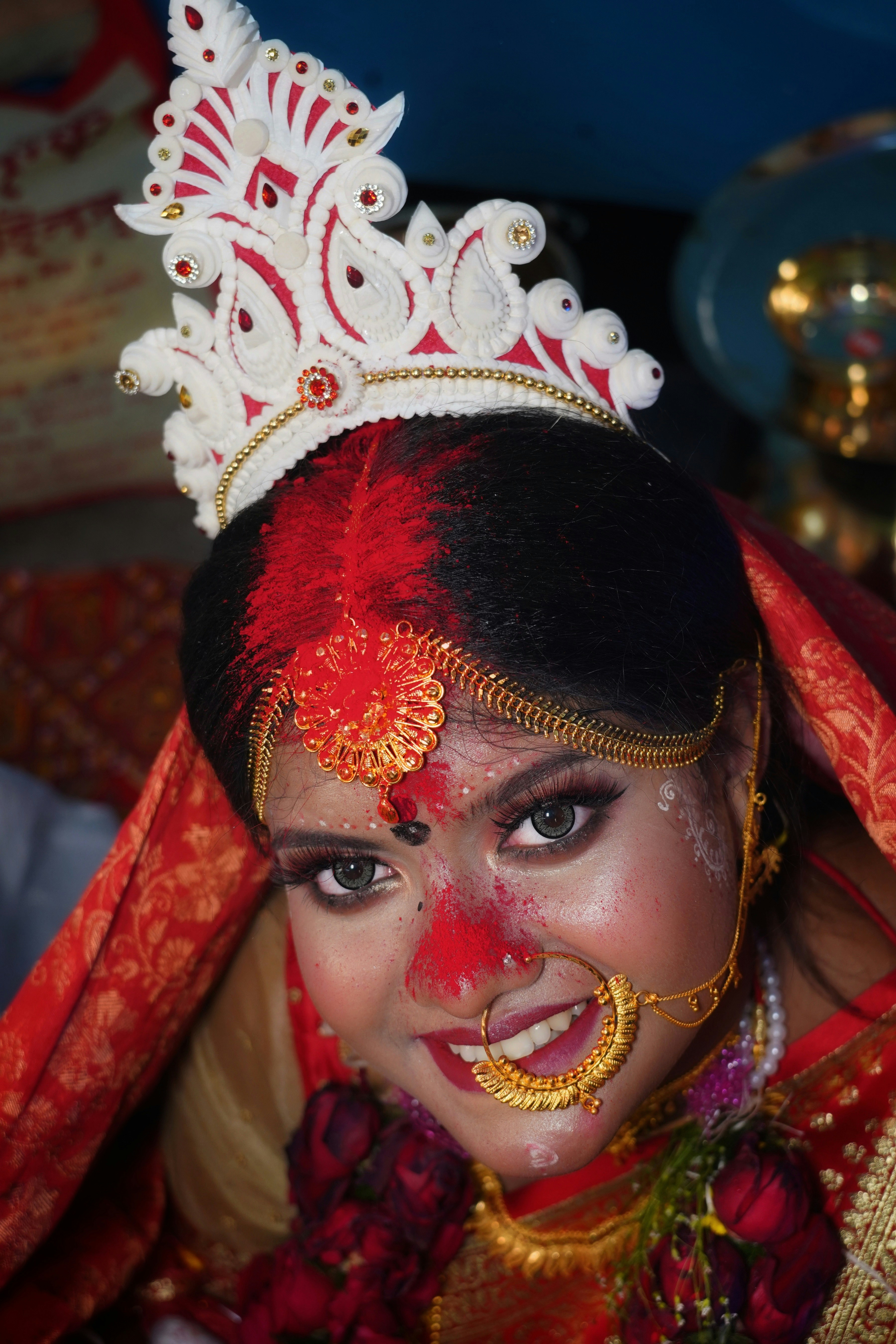a woman wearing a red and gold costume