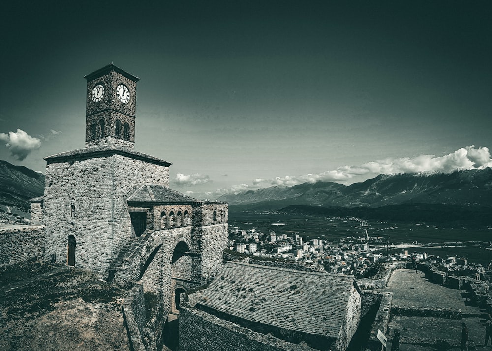 a black and white photo of a clock tower