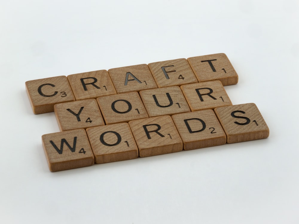 scrabbled wooden blocks spelling craft your words