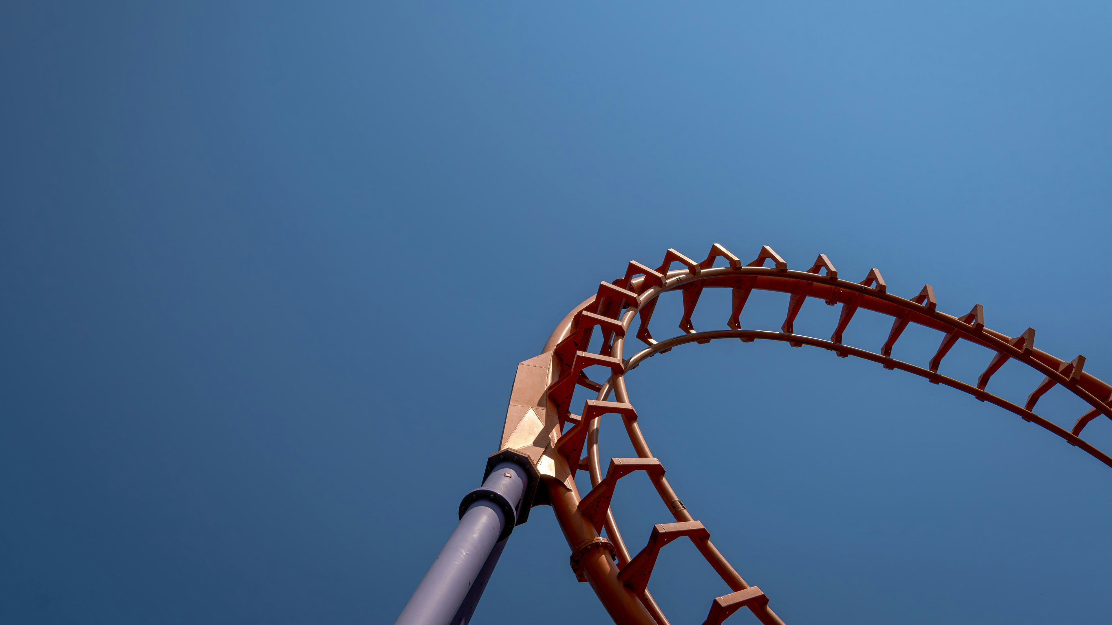 a close up of a roller coaster against a blue sky, "Speed of Sound", Rollercoaster in Walibi Holland (NL)