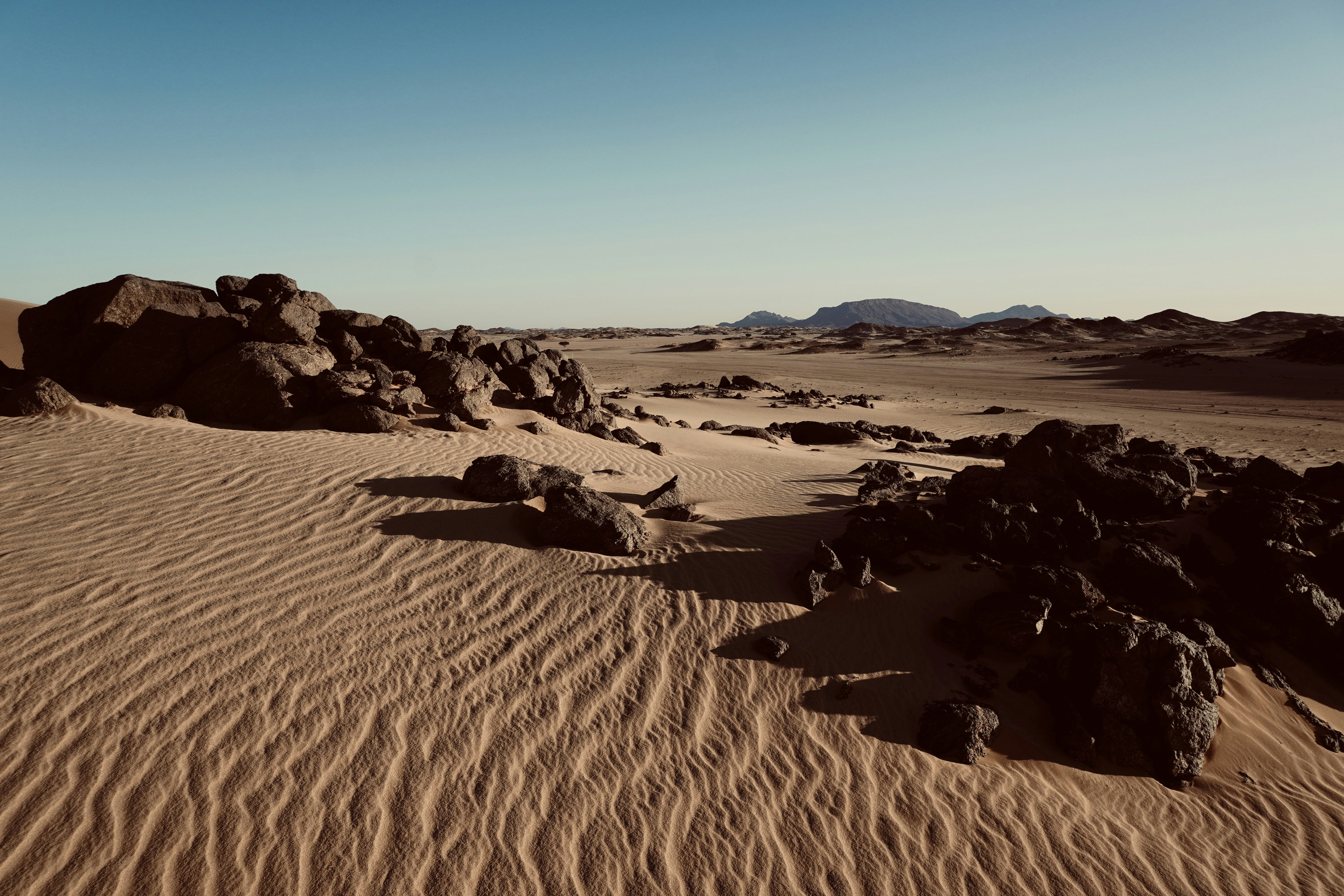 a desert landscape with rocks and sand