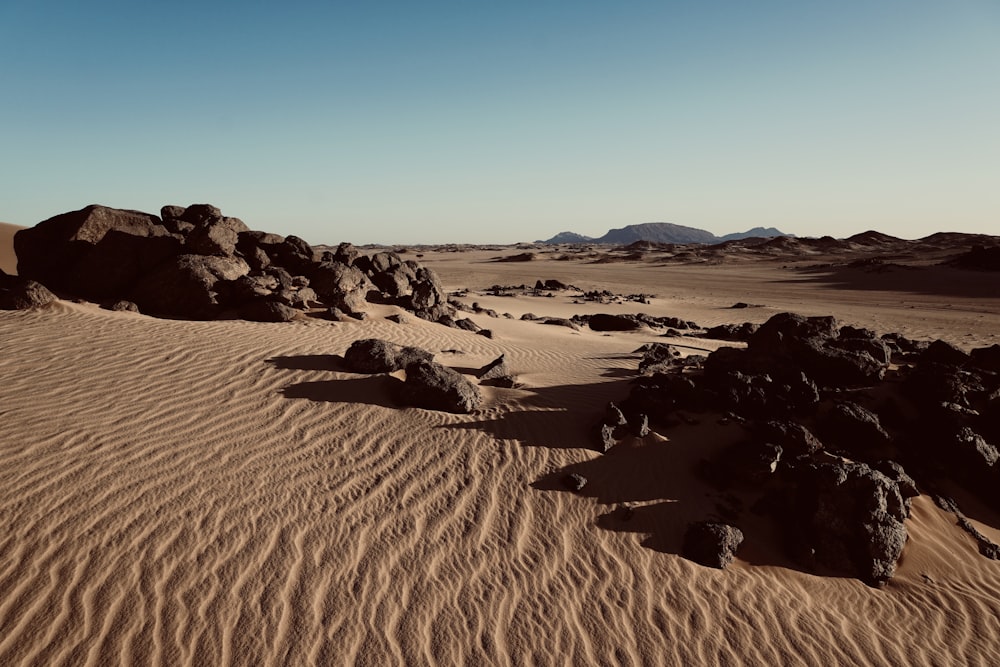 a desert landscape with rocks and sand