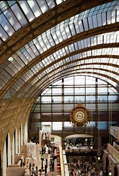 Visitors admiring the grand gallery filled with clocks.