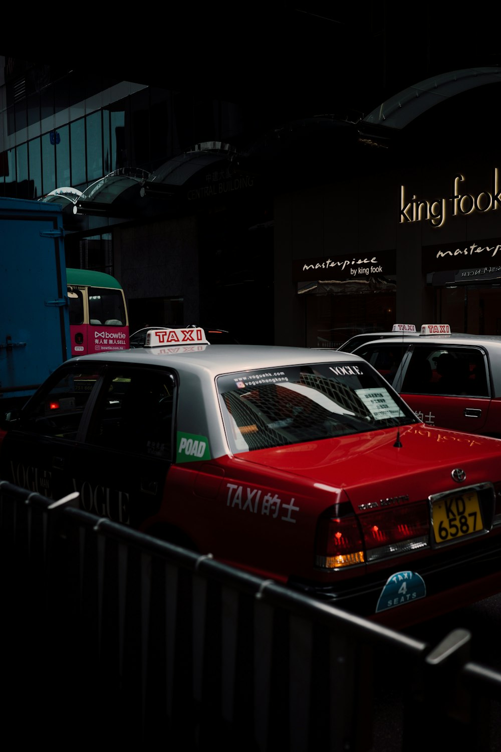 a group of cars that are sitting in the street