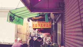 A vibrant street market in Shenzhen bustling with vendors and colorful products.