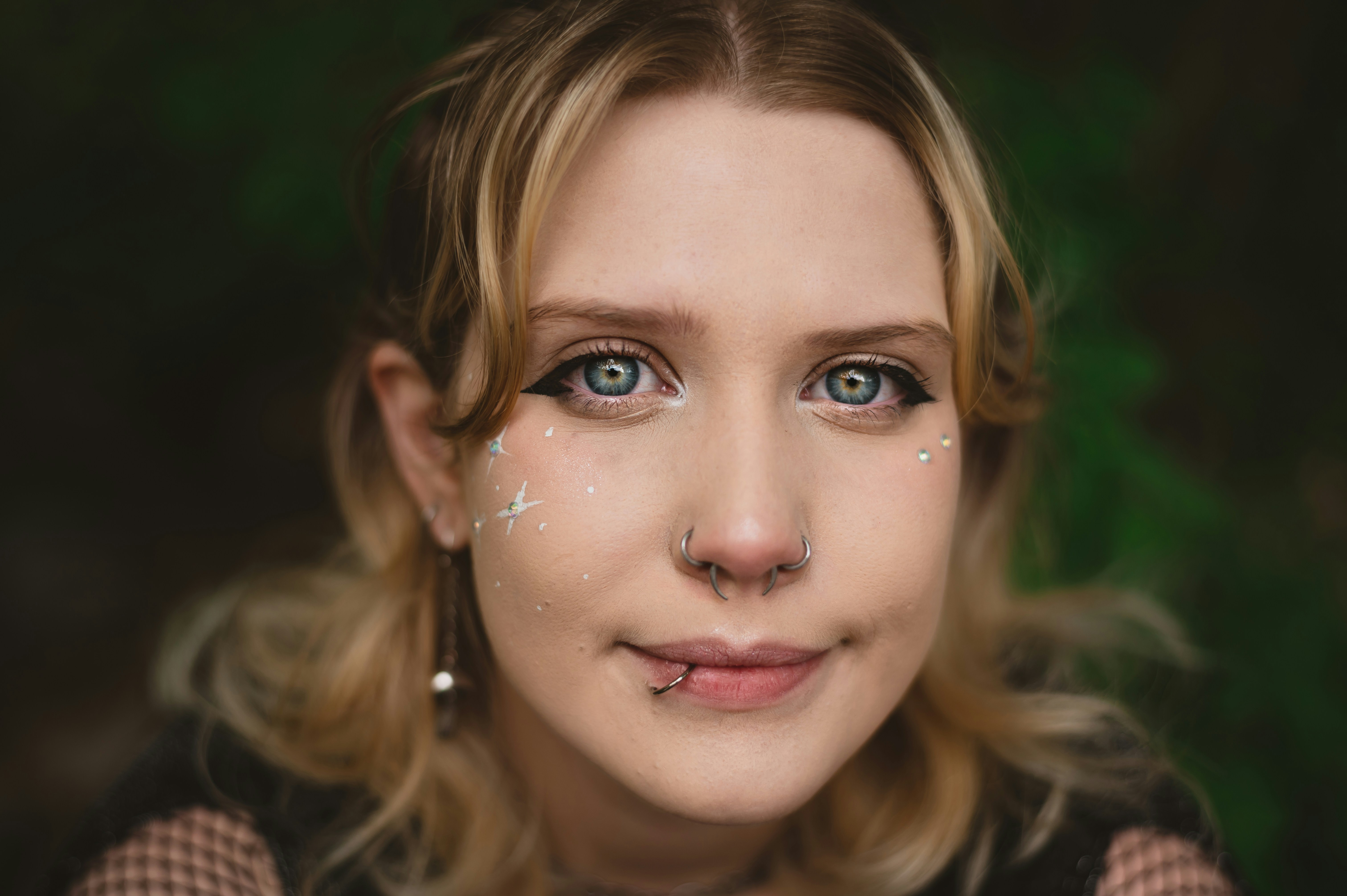 A close-up photograph of a person's face with glowing, futuristic digital data points and lines overlaid, symbolizing AI understanding an individual customer.