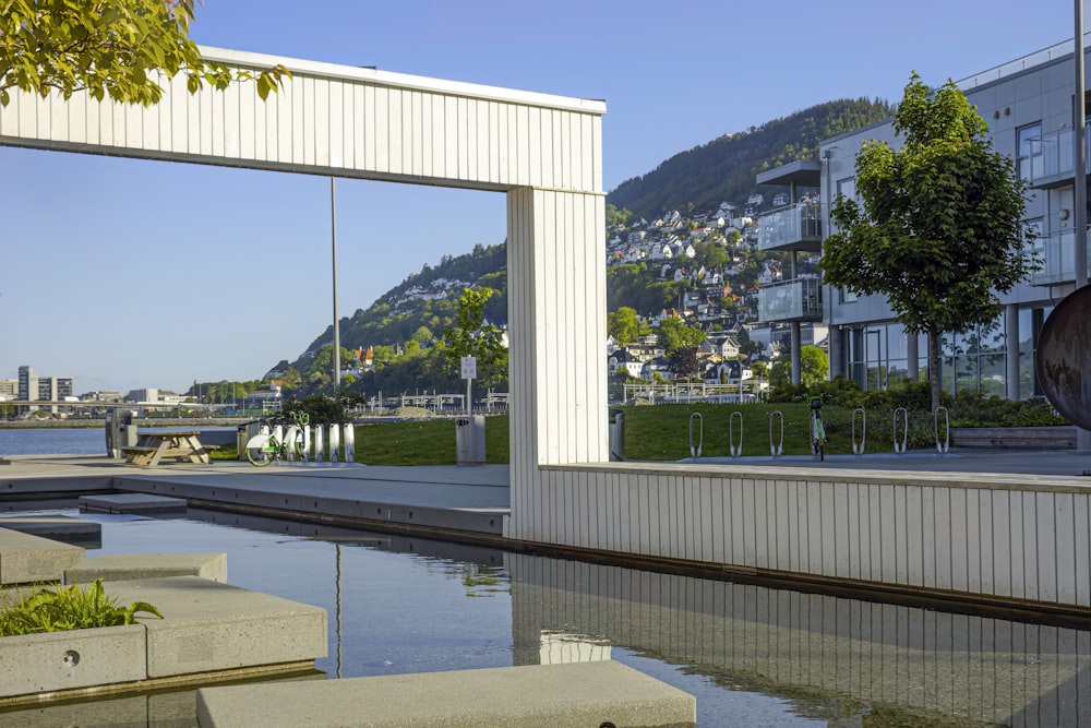 a reflection of a building in a pool of water