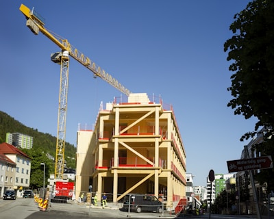 Construction site in Scott’s Addition showing cranes and workers collaborating on a multifamily development.