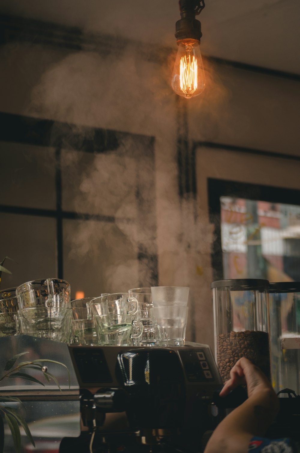 a coffee maker with steam coming out of it