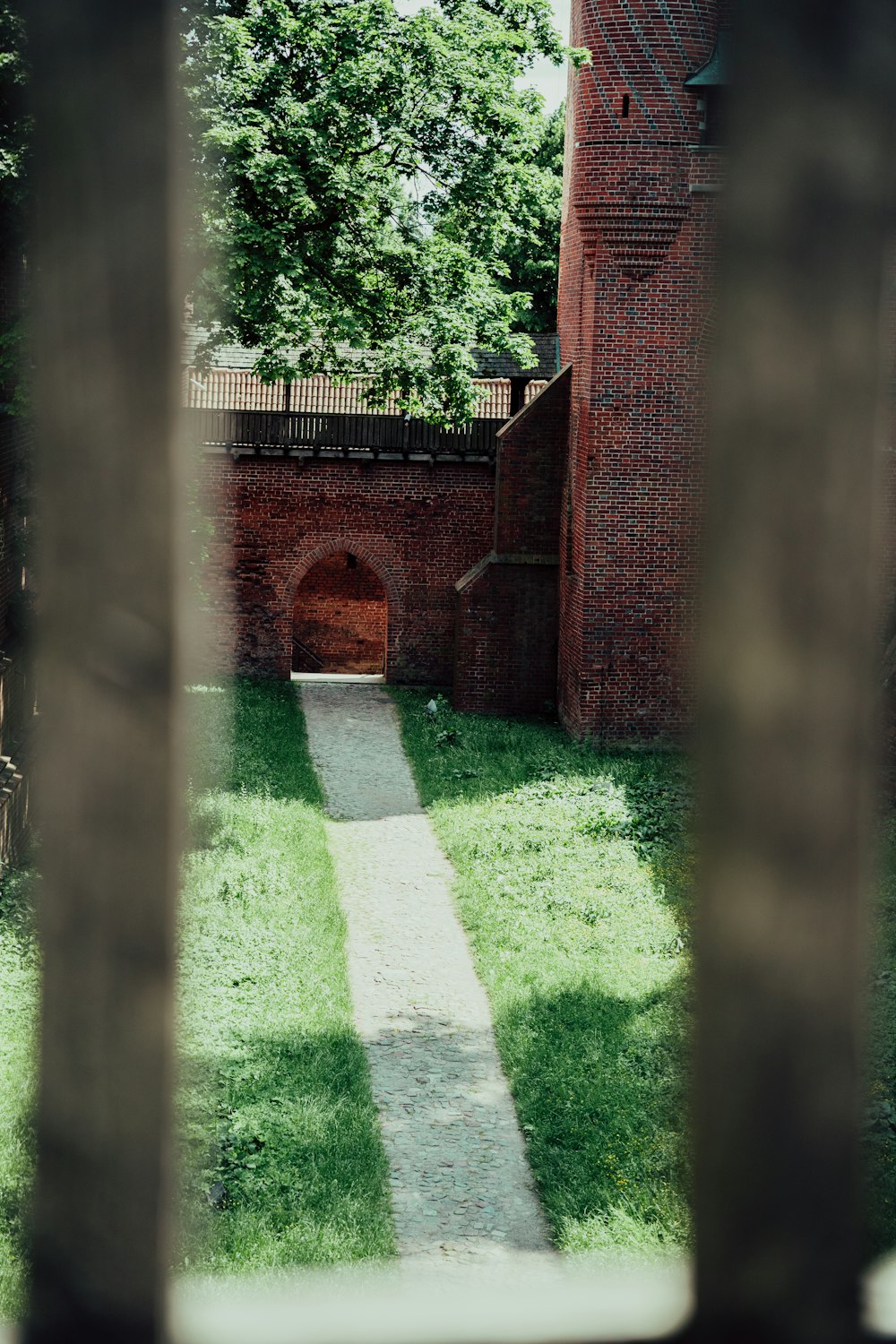 a view of a brick building through a window