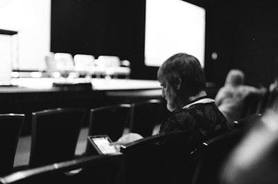 An online bidder participating remotely, viewing auction items on a tablet.