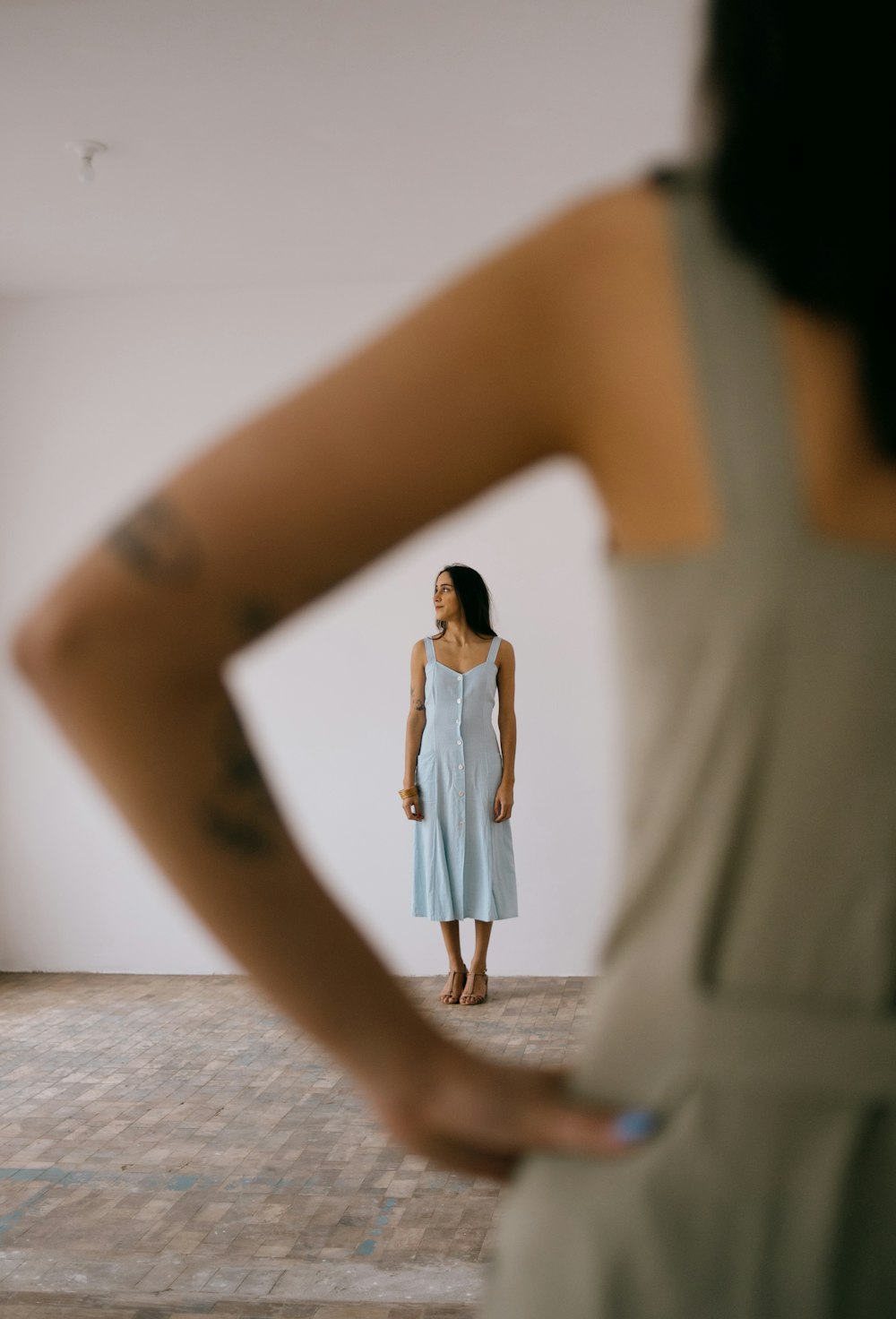 a woman looking at herself in a mirror