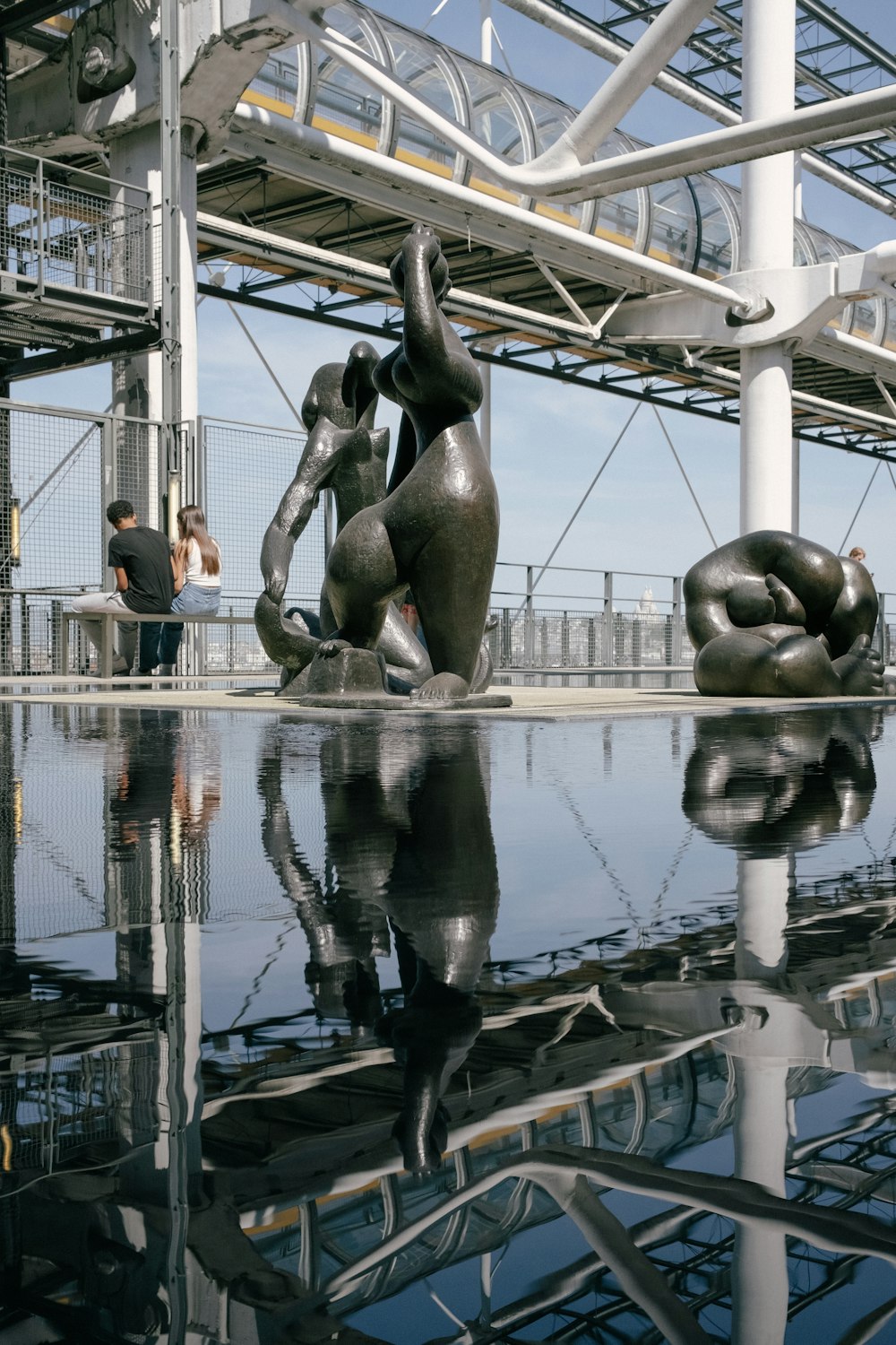 a couple of statues sitting next to each other