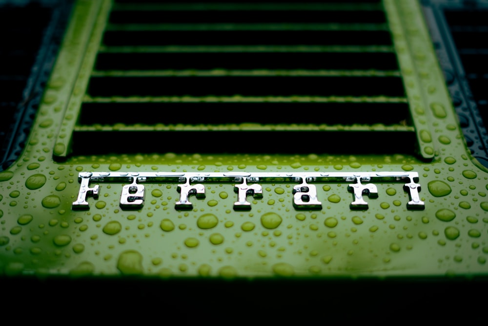 a close up of a metal structure with water drops