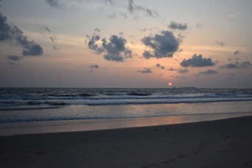 A serene beach sunset inviting visitors to imagine their next getaway.