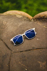 Close-up of eclipse glasses with a starry sky background