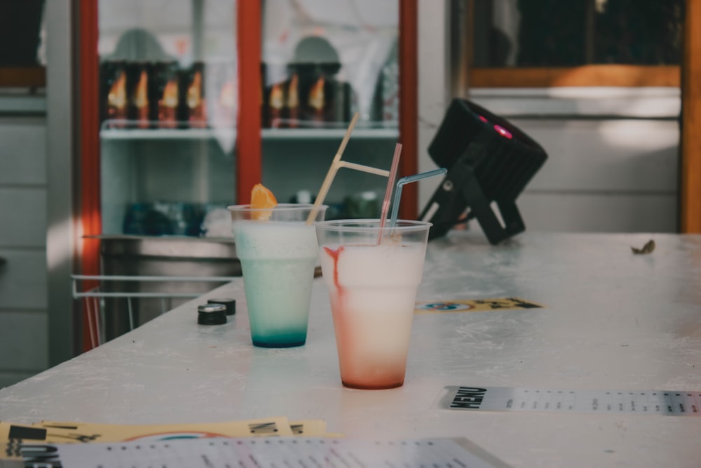 a couple of drinks sitting on top of a table