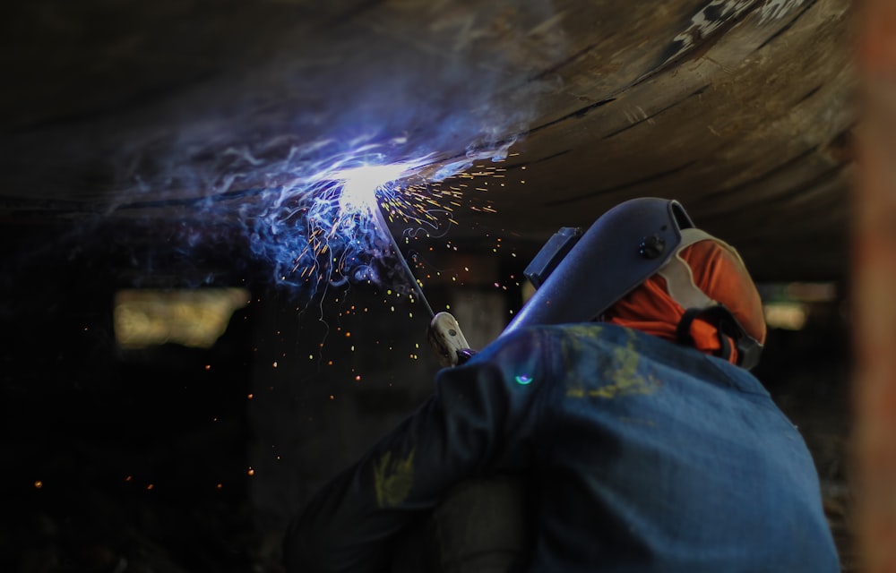 a welder working on a piece of metal