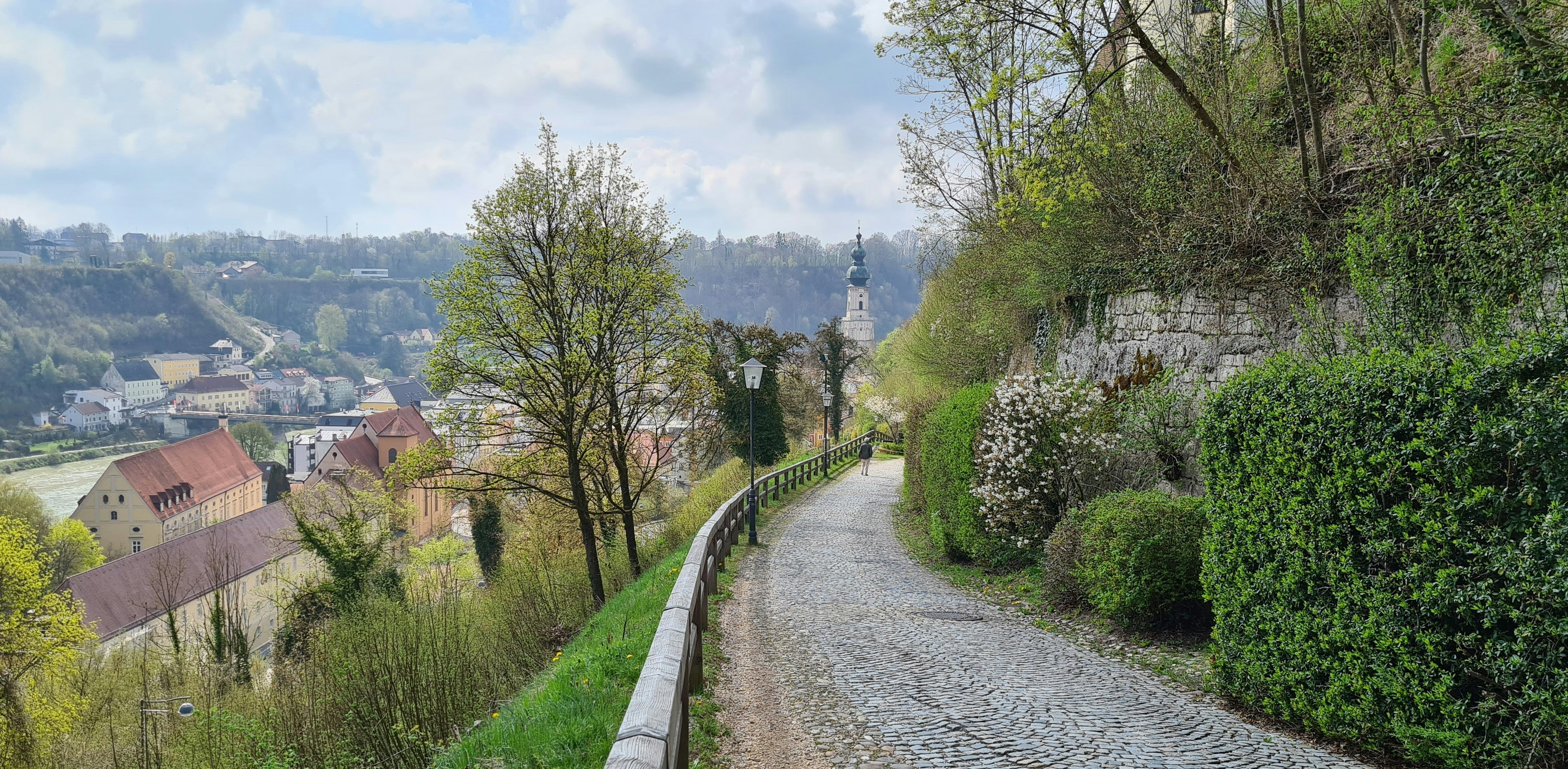 a cobblestone road winds through the countryside