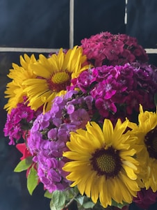 A lively bouquet bursting with colorful flowers against a bright, cheerful background reflecting Gulf Bloom's vibrant spirit.