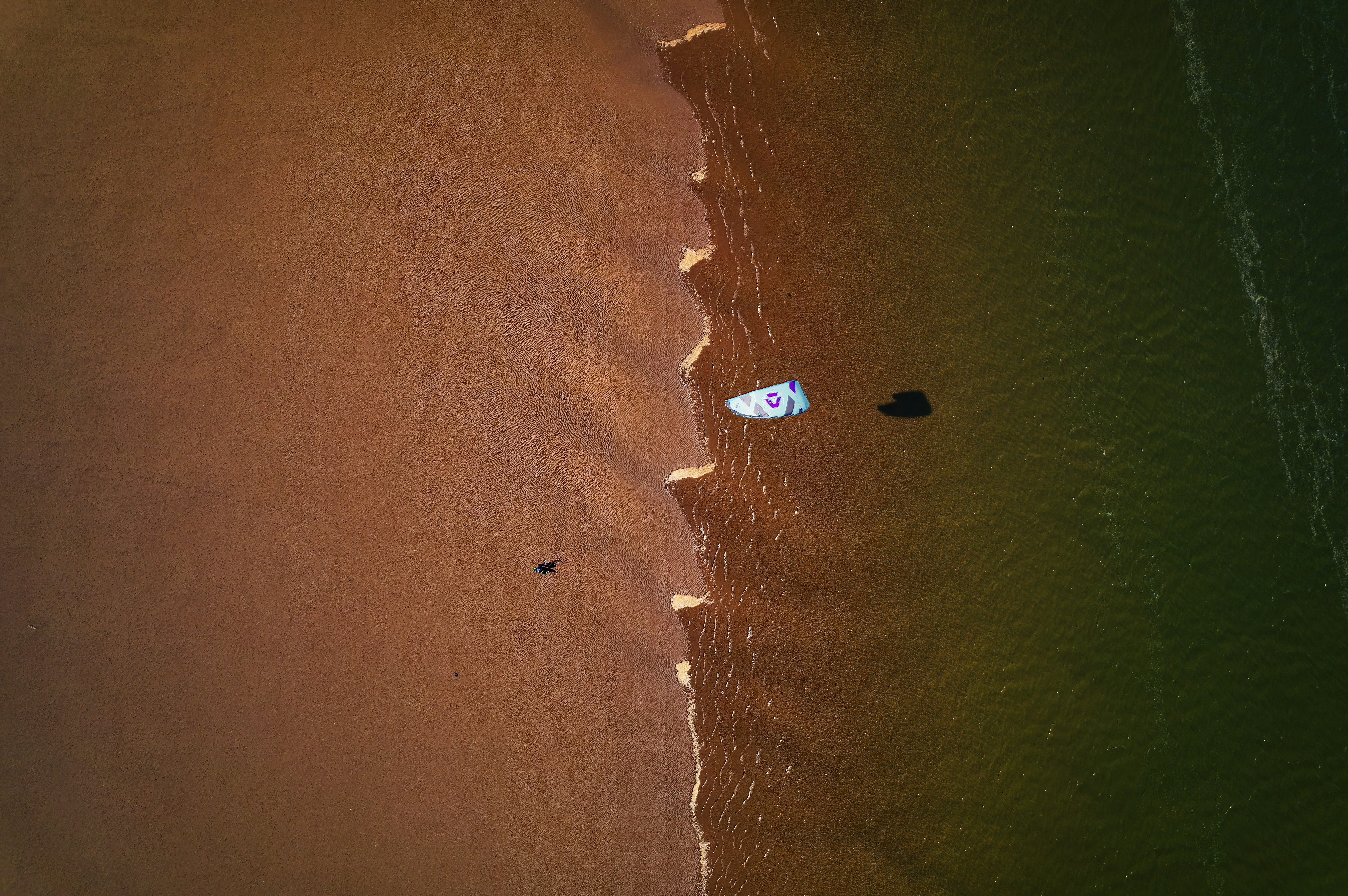 an aerial view of a beach and a body of water