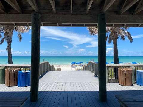 a view of a Florida beach from a covered walkway