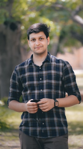 Customer happily holding a purchased product outdoors