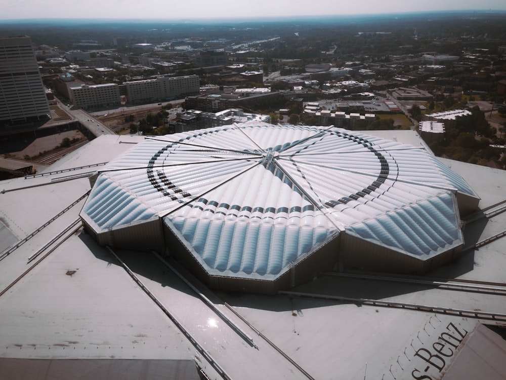 an aerial view of a building with a circular roof