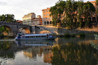 Guests enjoying a luxurious Nile cruise, with the river’s calm waters reflecting the sunset.
