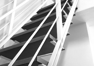 a black and white photo of a staircase