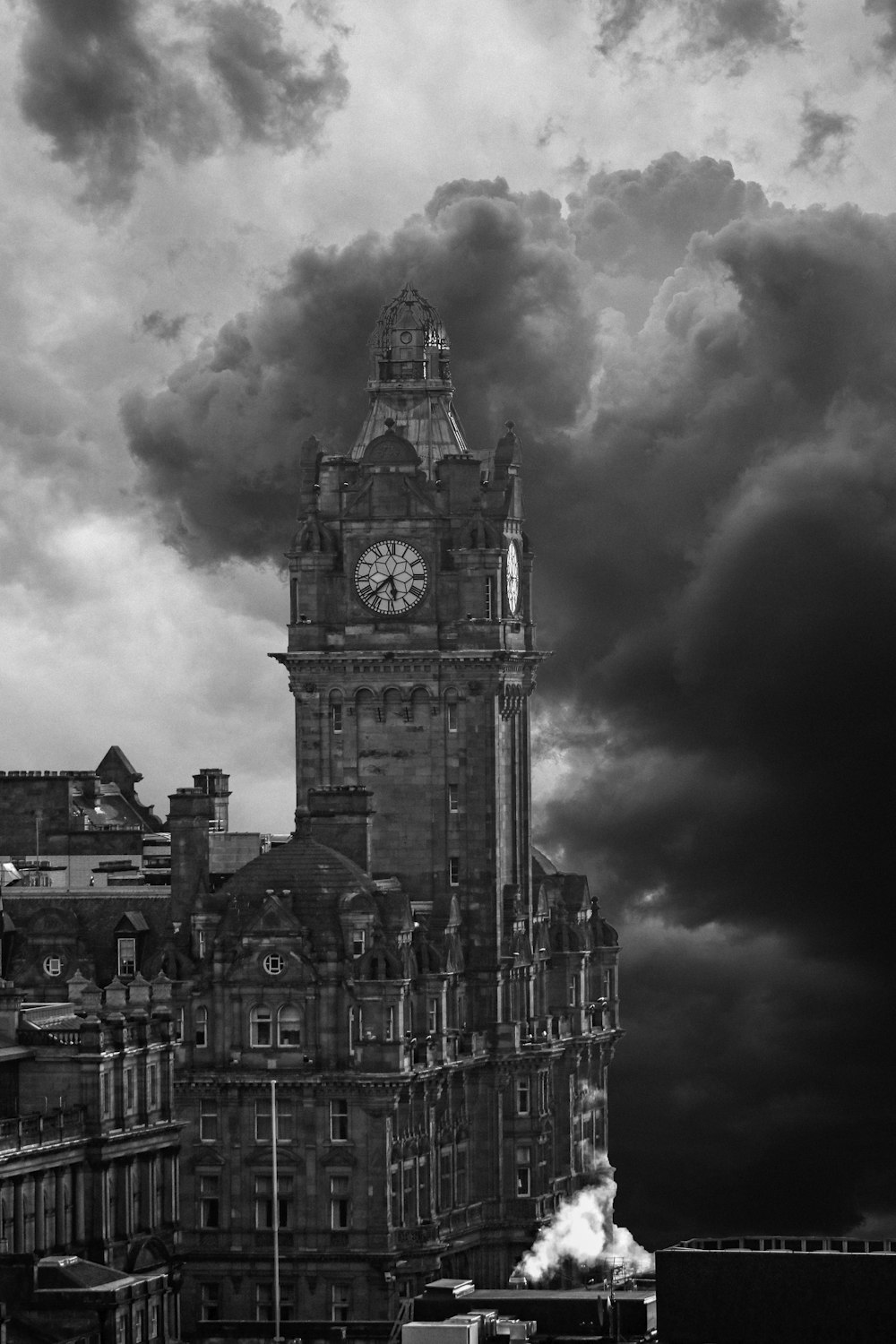 a black and white photo of a clock tower