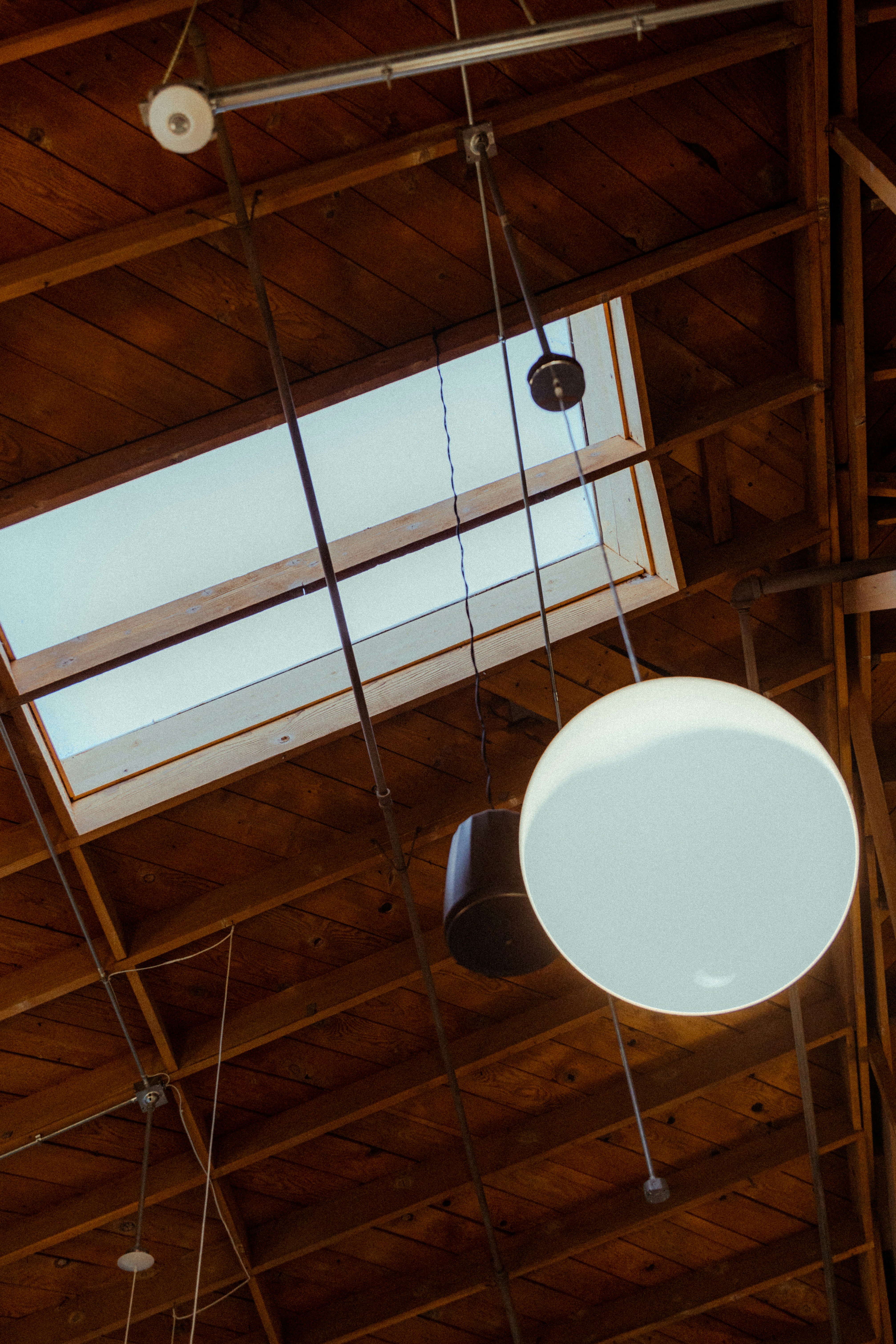 a ceiling that has some lights hanging from it