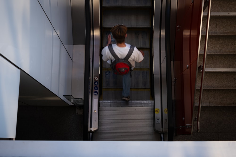 a man is walking down a flight of stairs