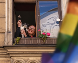 A happy family welcoming a newly adopted cat into their home.