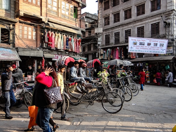 A vibrant street scene showing diverse men and women wearing stylish, casual fashion pieces.