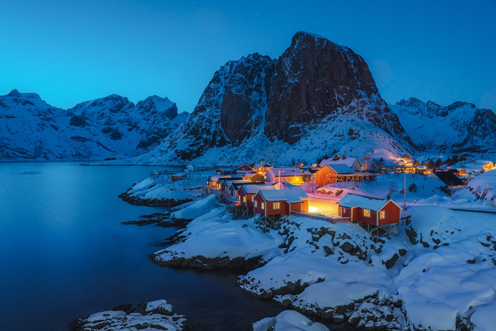 a snowy landscape with a mountain in the background