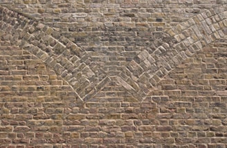 a brick wall with a chevron pattern on it