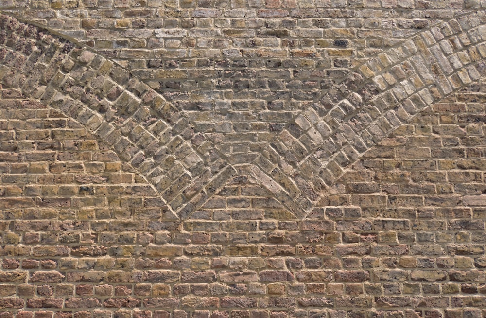 a brick wall with a chevron pattern on it
