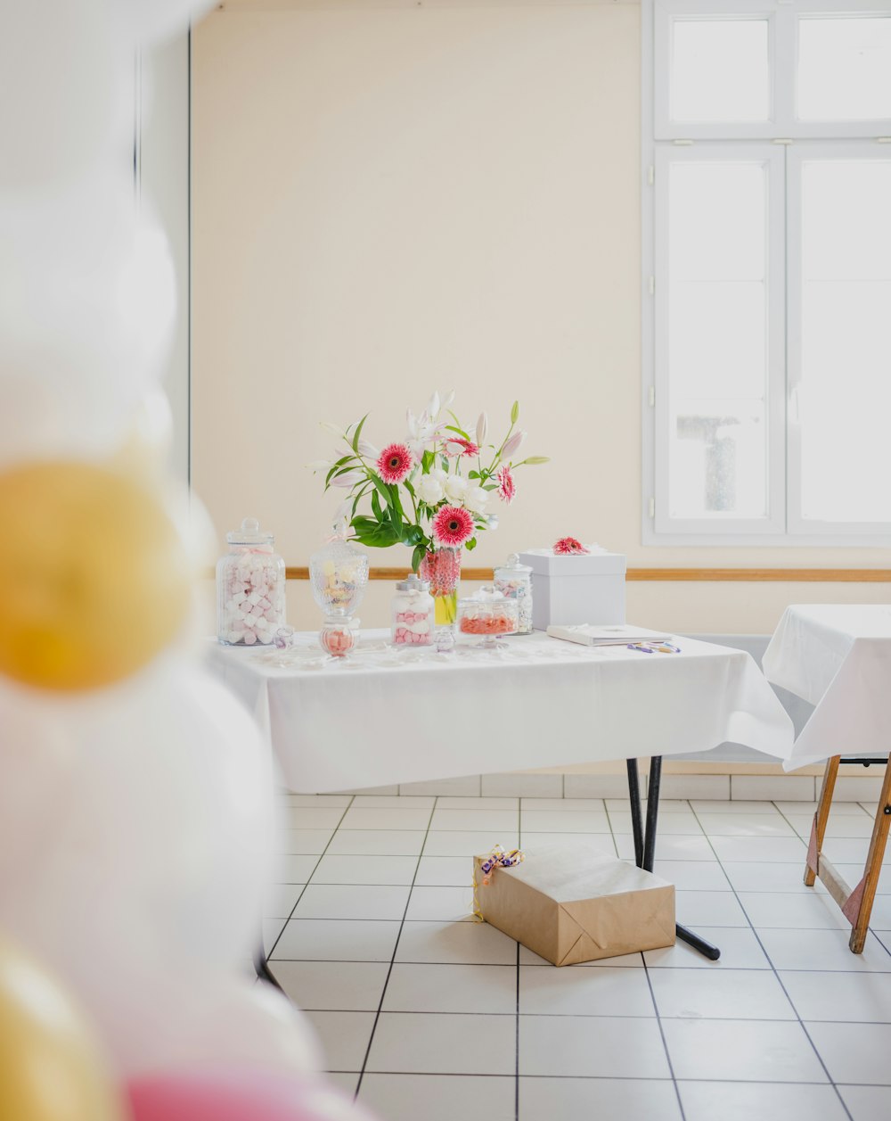 a table with a vase of flowers on it