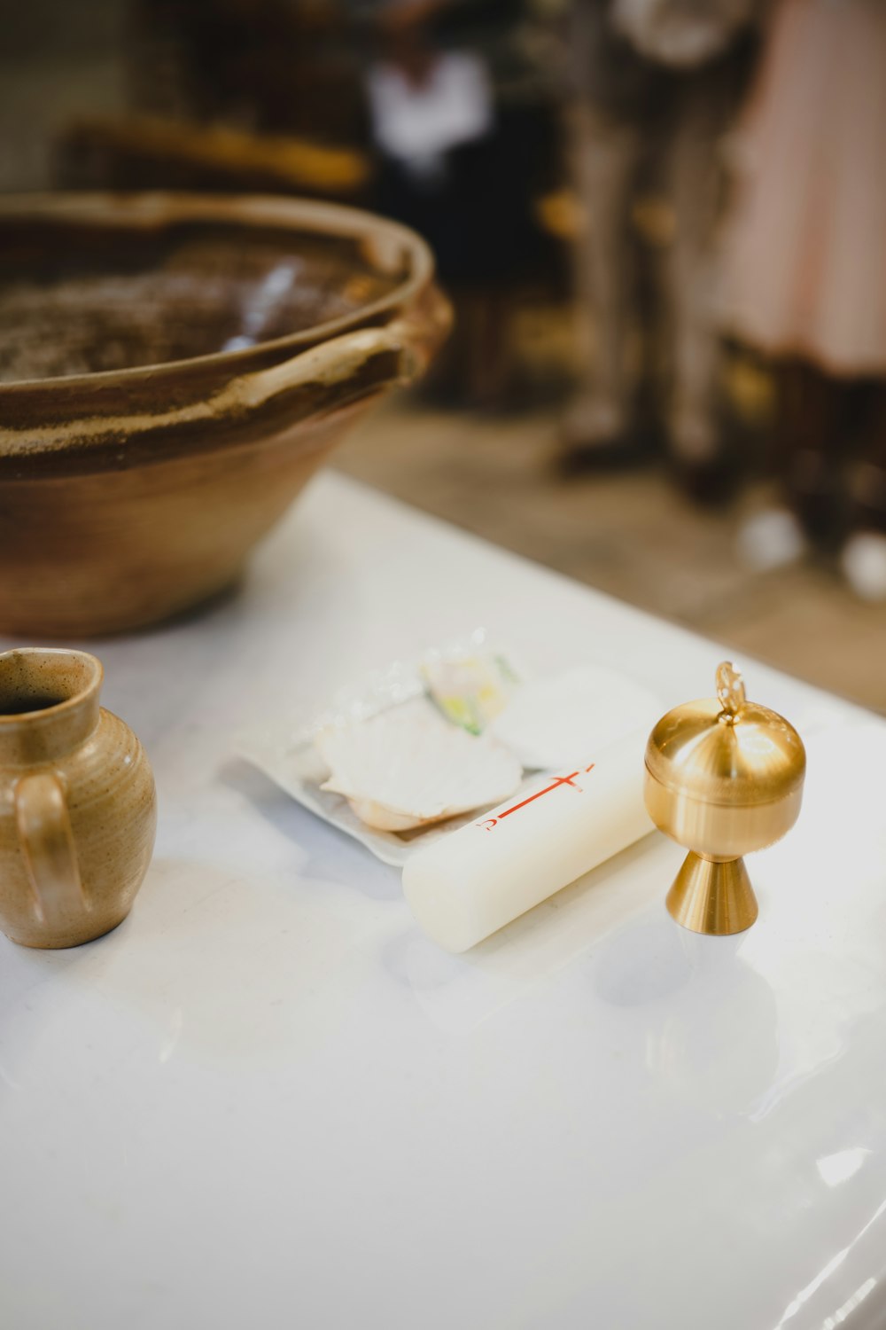 a white table with a gold ring on it